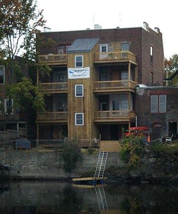 Each apartment has a private deck overlooking the river. 