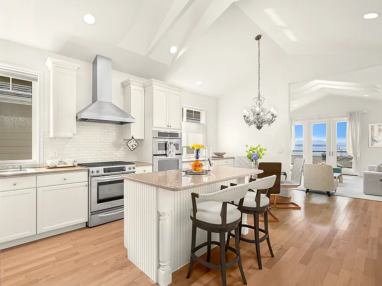 Kitchen, Dining, Living Room with deck and view of the bay.