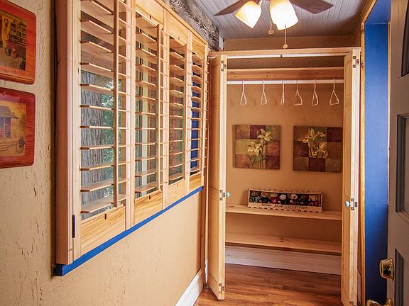 OLD PHOTO OF ENTRYWAY CLOSET WITH 3 SHELVES FOR SHOES OR STORAGE. JUST UPGRADED MARCH 2022