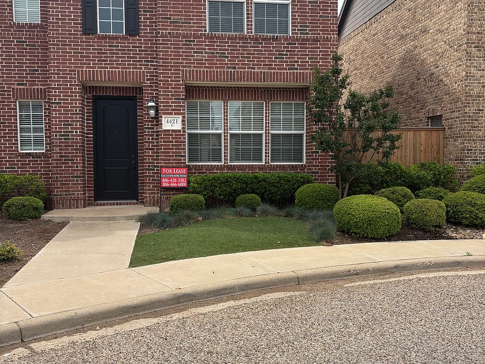 Front entryway with beautiful maintance free lawn