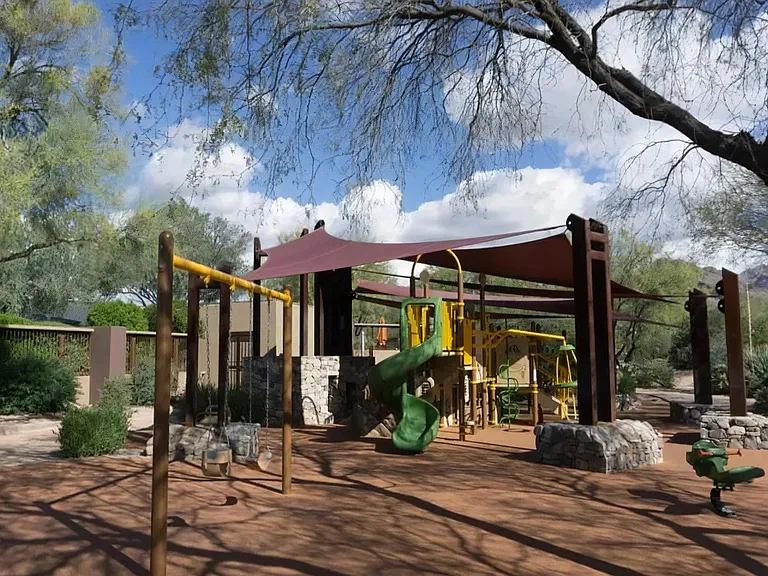 Local Playground with Slides, Swings, and Shade Canopy