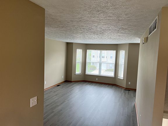 Expansive living room adjacent to the dining area.
