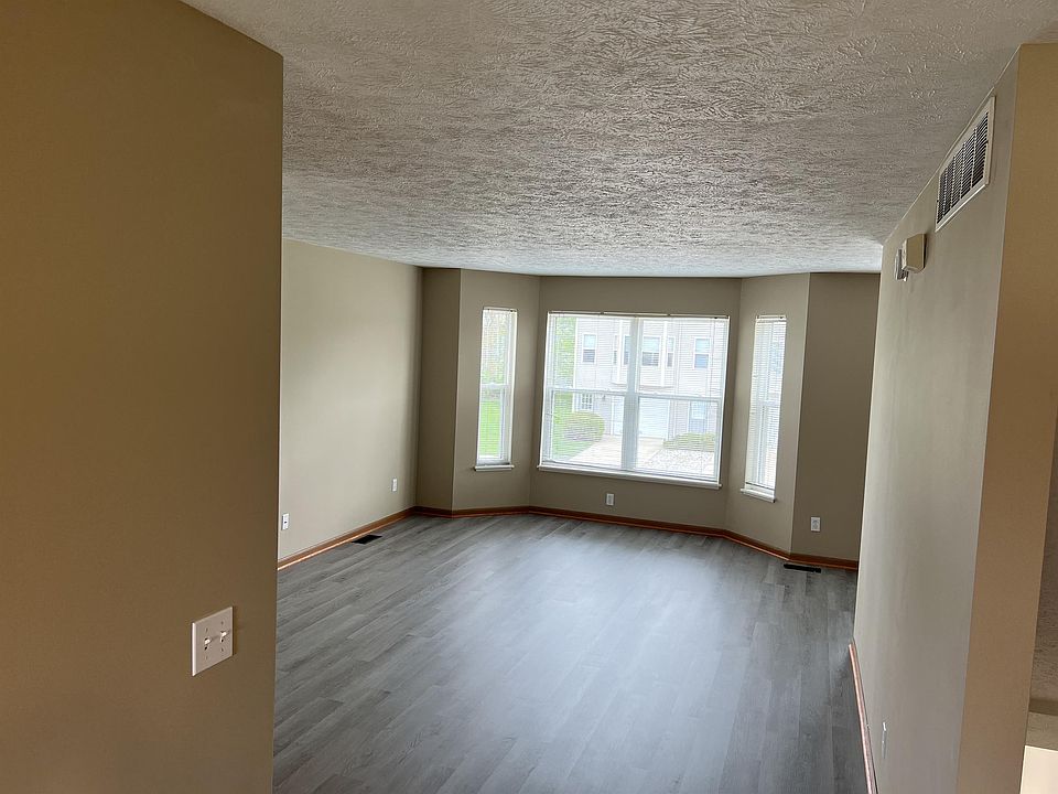 Expansive living room adjacent to the dining area.