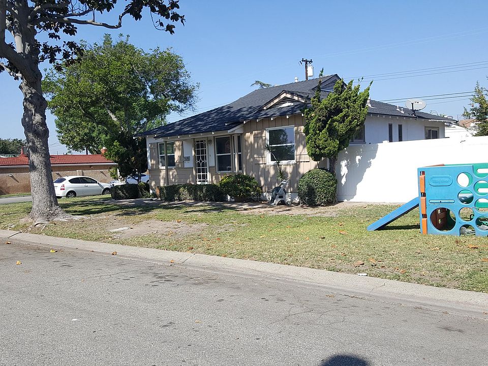 front of house and side yard which is very private with tall