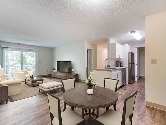 Renovated Package I dining and living room with hard surface flooring