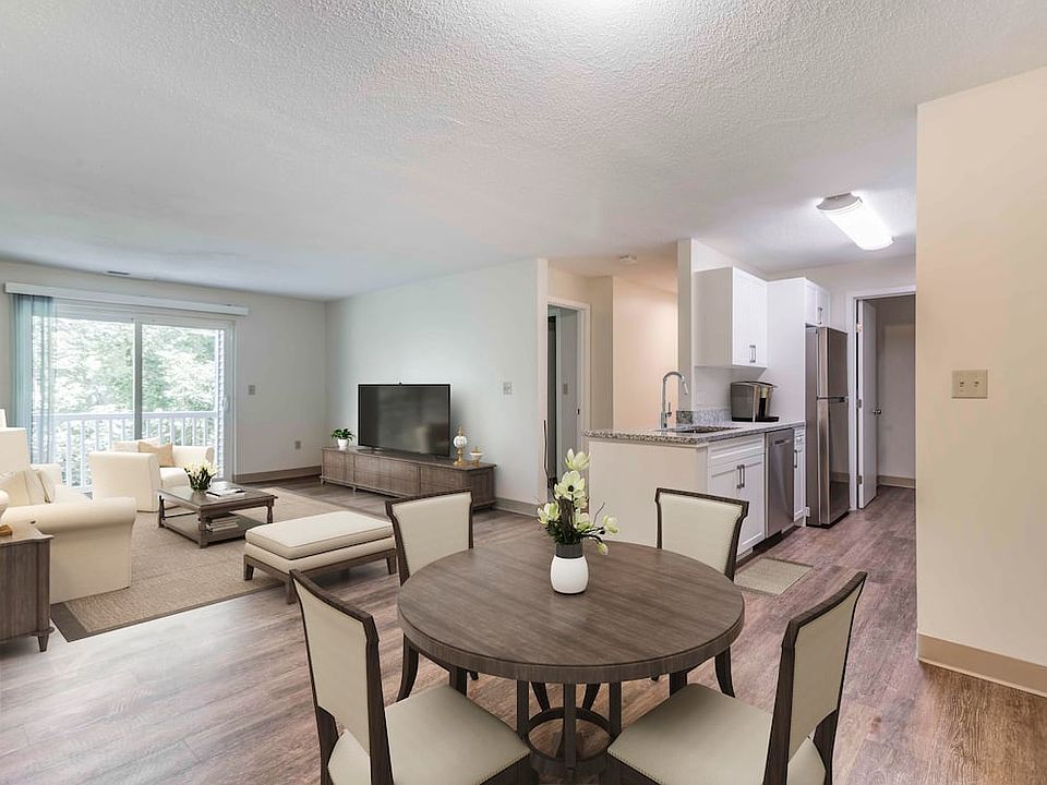 Renovated Package I dining and living room with hard surface flooring