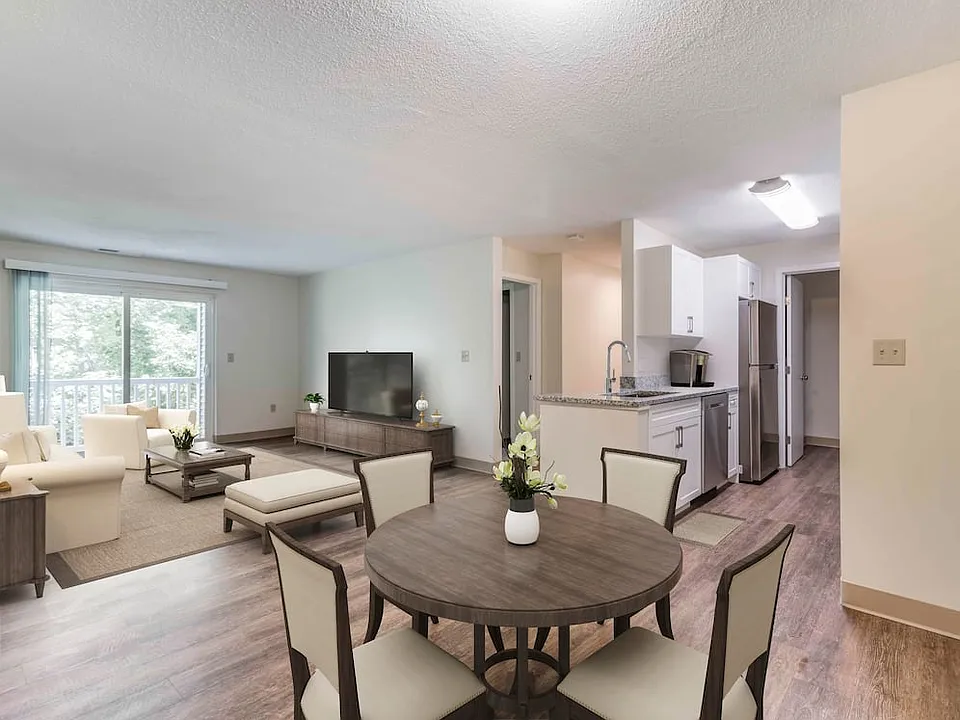 Renovated Package I dining and living room with hard surface flooring