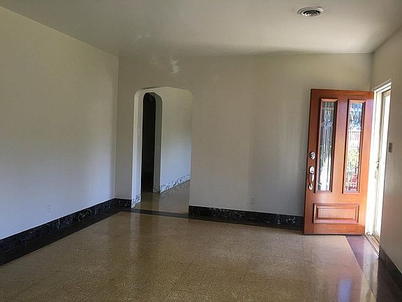 Entrance into living room; arched openings give 'open feel'