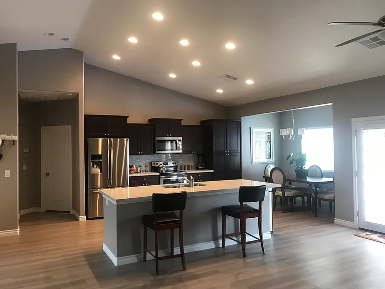 Kitchen with island and dinning room.