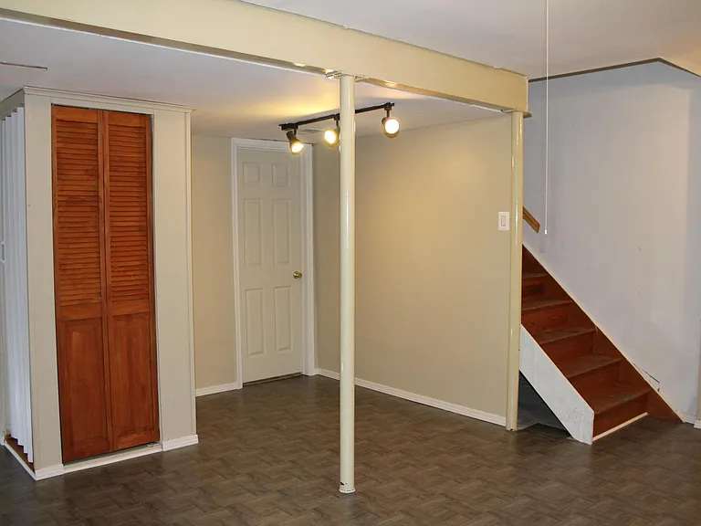 Access to storage room with laundry and walkout.
