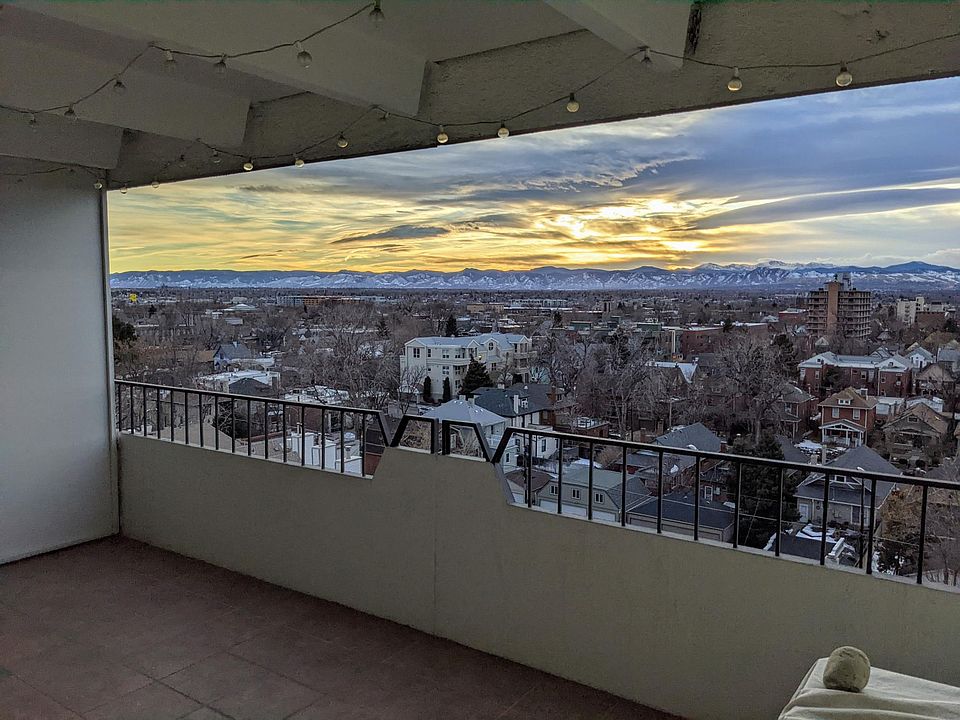 Private, tiled, west facing balcony with 180 degree view of the mountains and downtown Denver. Unobstructed sunset views each evening.