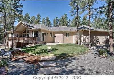Back of Home with Covered Deck and Patio Walk-Out