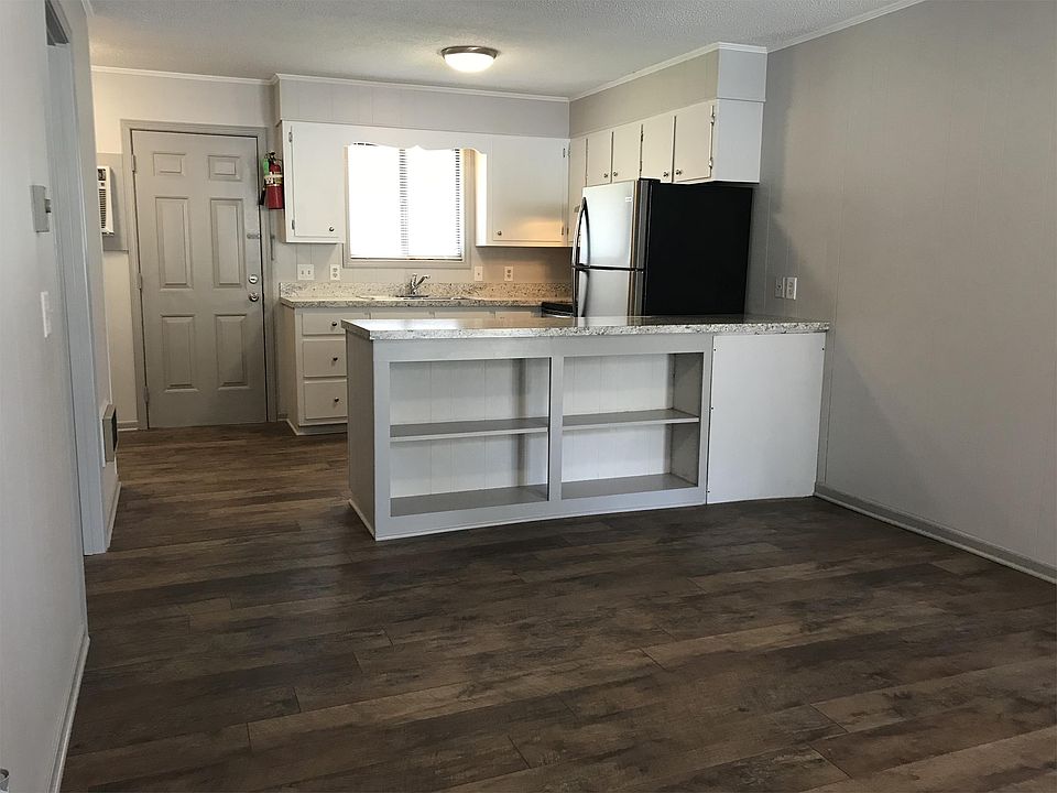 Living room, looking into kitchen.