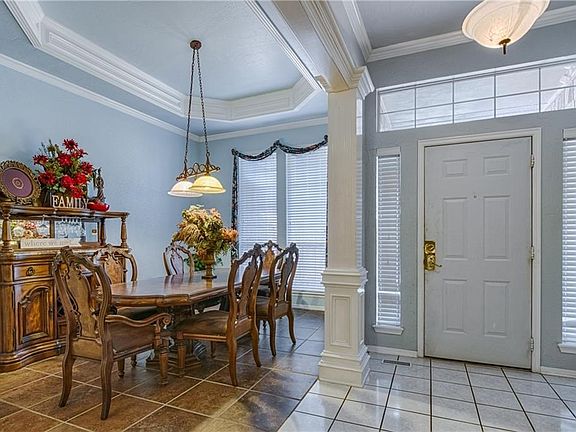 Grand entry with cool colors and elegant crown molding