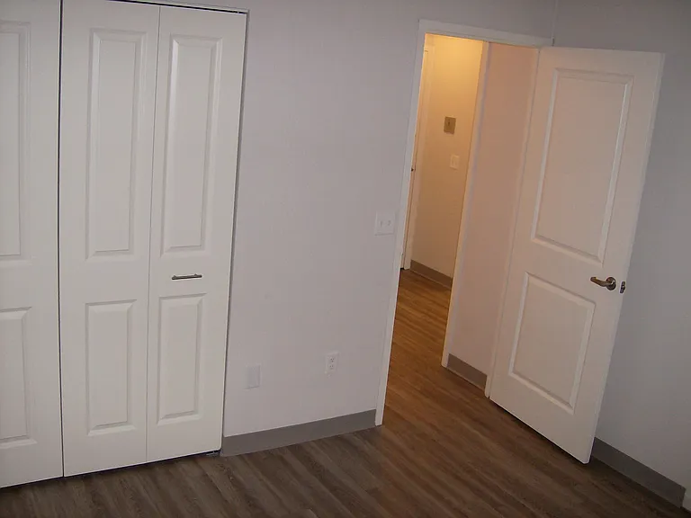 Bedroom Photo With Closet And Hallway