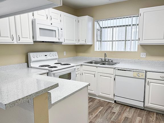Kitchen in the 3 bedroom apartment. Most Kitchens have black appliances.