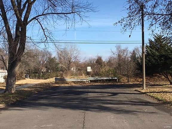 View from Marseille Drive ending at property line.