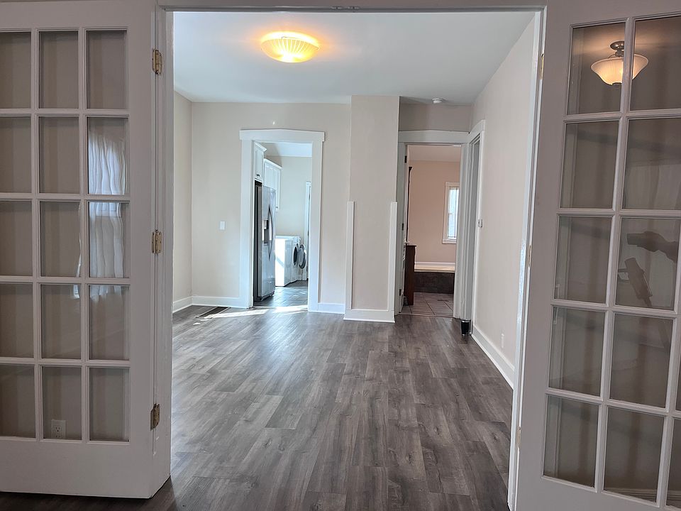 Looking from front room into the middle room of first floor.