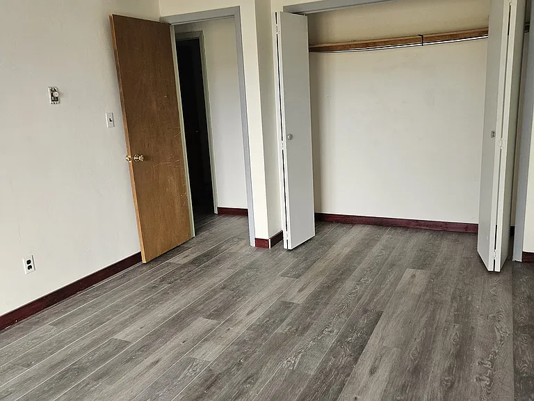 3rd bedroom/office downstairs with sliding doors to outside