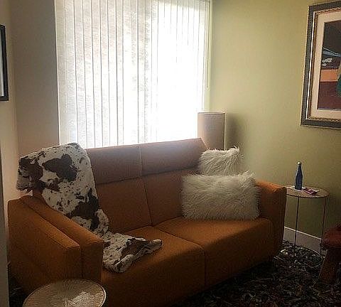 Den with sliding door