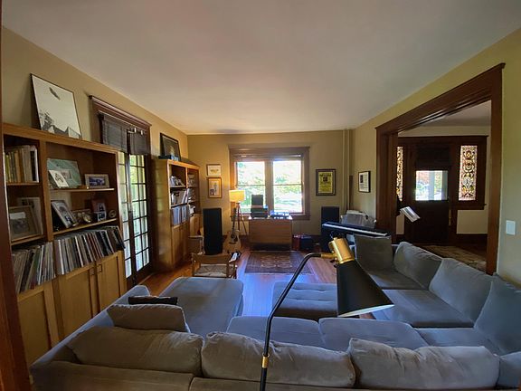 Large living room with built-ins and French doors to side porch