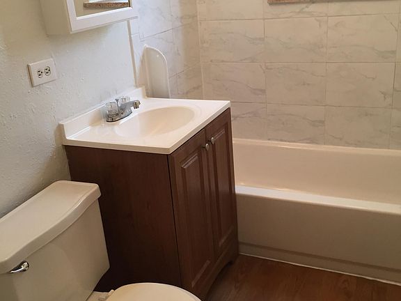 New bath tile, floor and cabinets.