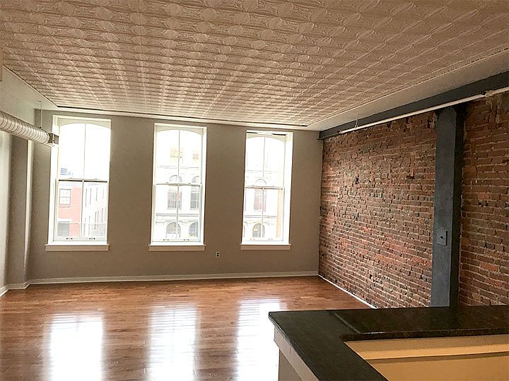 Light Bright Loft-Style Living Area. Hardwood floors, tin ce
