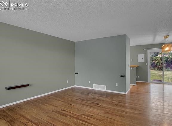 Beautiful, bright living room with view to dining room