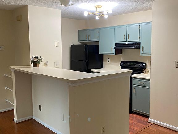 Beautiful kitchen, soothing sage cabinets and gold accents for a modern look.