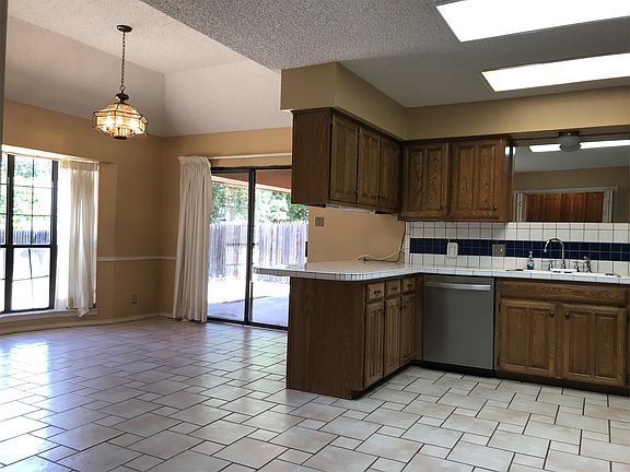 Large dining room is off the kitchen and opens to the back patio for great flow get togethers..