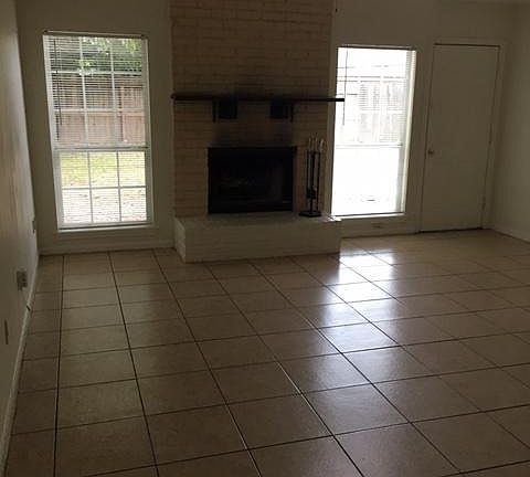 Living Room with fireplace and access to backyard