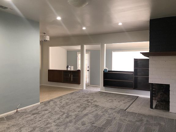Living Room with new coat of paint and new carpet.