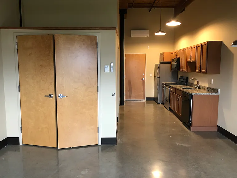 Apt 446 (studio) has an additional clothing closet, and a coat closet upon entering the apartment (on the other side of the fridge in this photo)