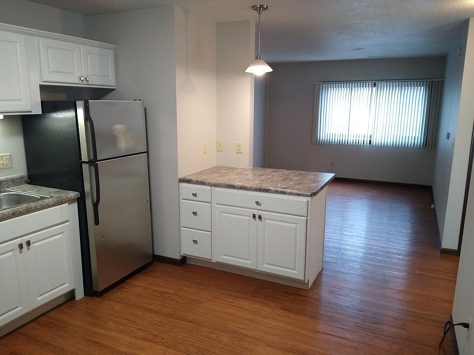 Newer kitchen with living room beyond