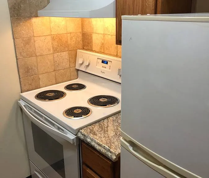 Experience efficient cooking in this neatly designed kitchen space. Experience efficient cooking in this neatly designed kitchen space.