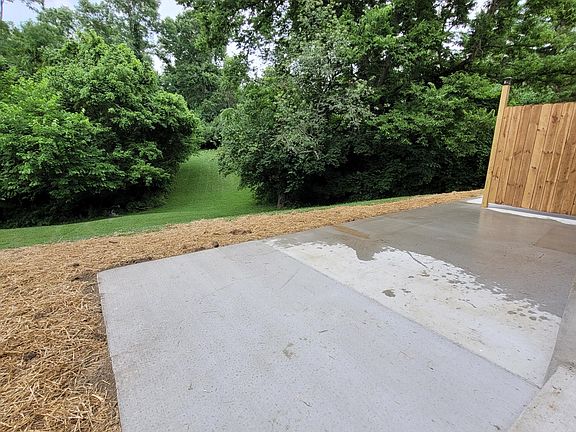 back patio with view of wooded backyard