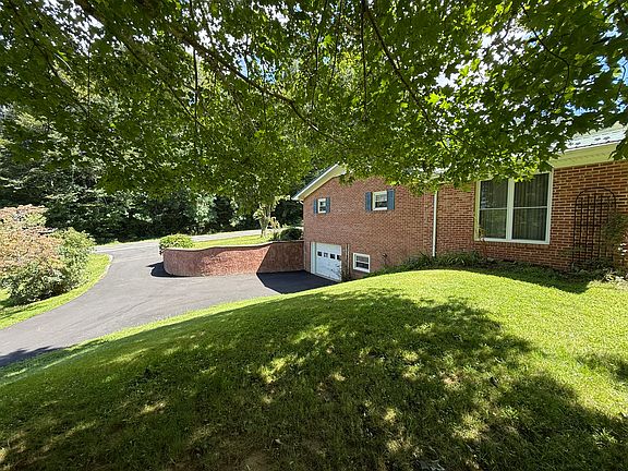 Side of the home and lower driveway