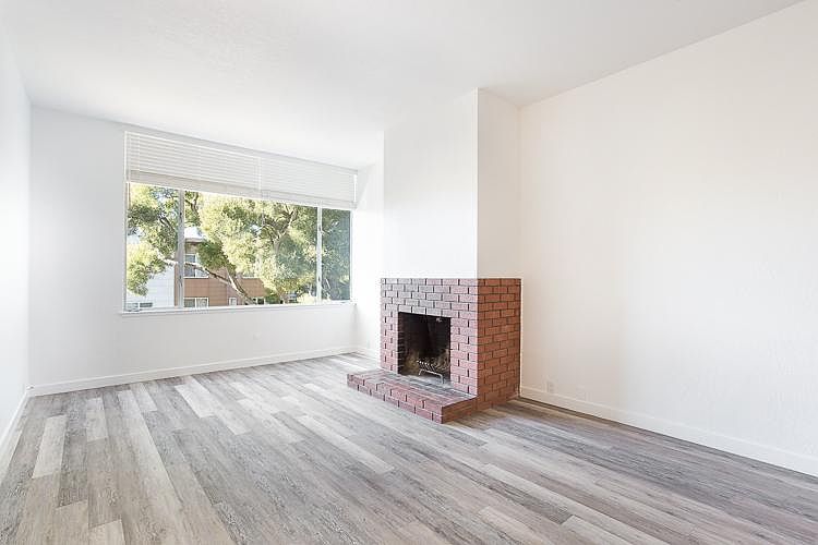 Living room with wood burning fireplace