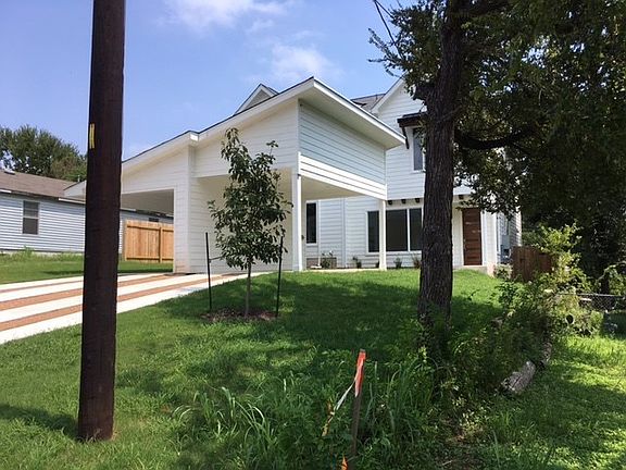 House to the left of the property.  Lots of new construction in the area.