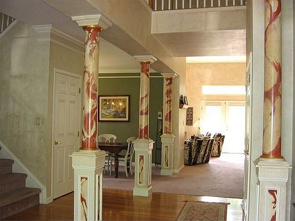 Dramatic Entry Foyer w/Architectural Columns & Hardwood Flooring