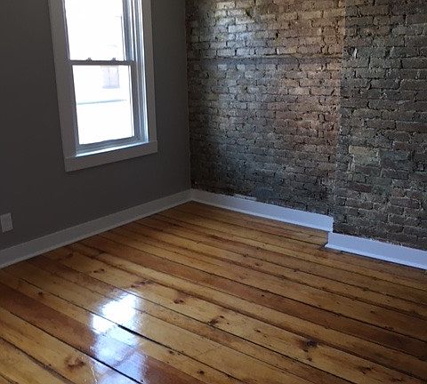 Large, First Floor Living Area with Original Hardwood Floors