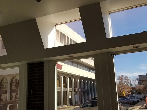 Den skylight, open beams, high ceilings