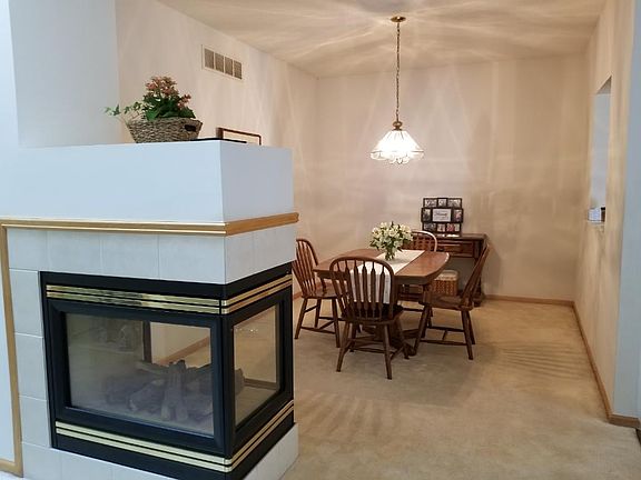 Dining room with see through fireplace. Great setting for your dinner guests.