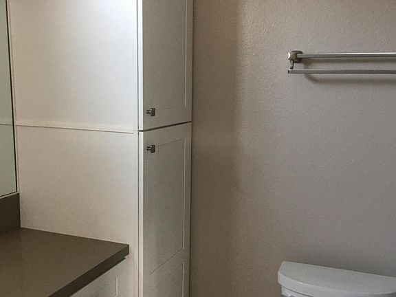 Master bath with shower tub and extra storage,