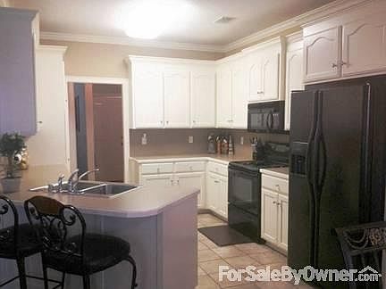 Kitchen
						:
						Ample cabinet space complete with pantry!