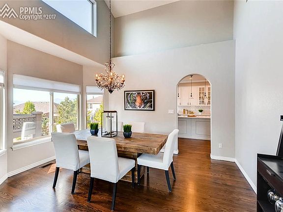 Formal dining room off kitchen with vaulted ceiling