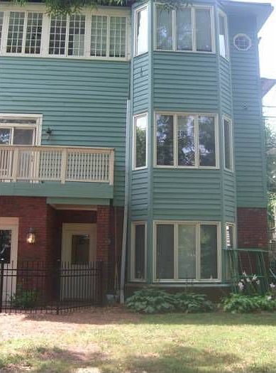 Back view of the home w/apartment entrance (bottom level)