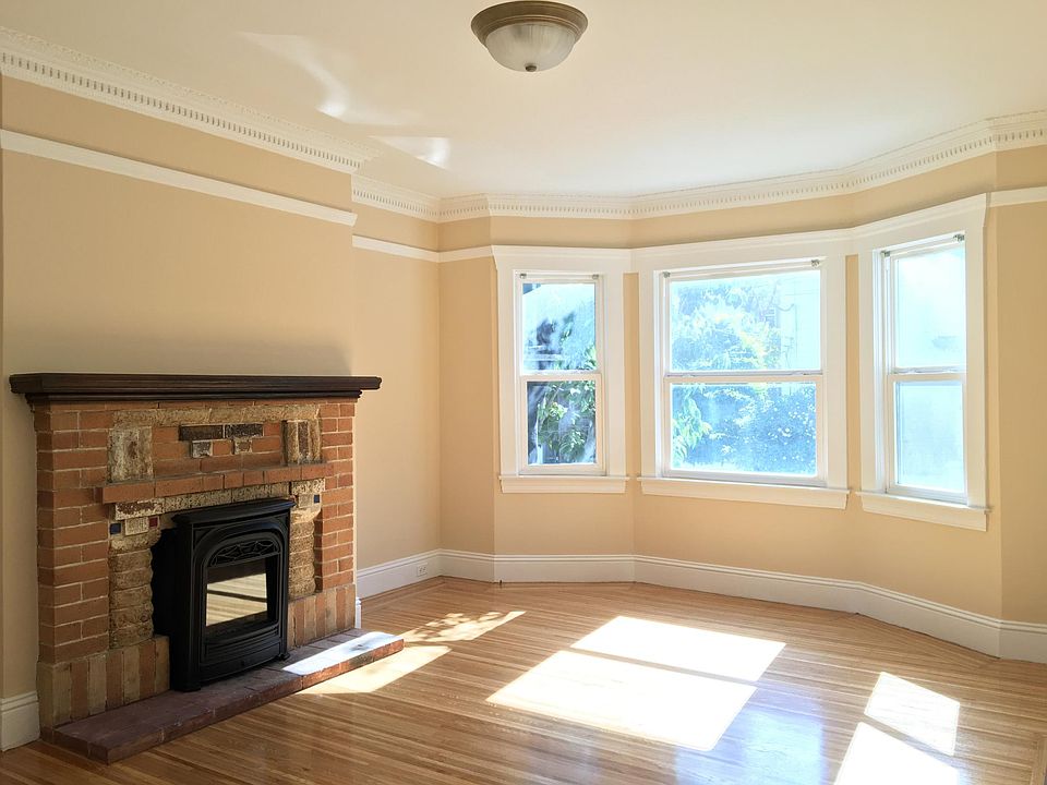 Enter into the Bay-windowed living room, with brand-new, remote-controlled gas log fireplace!