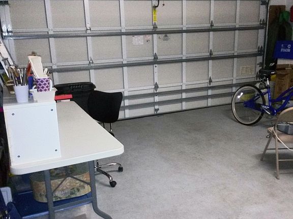 GARAGE HAS WALL OF CABINETS