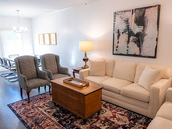View of living room and dining room.